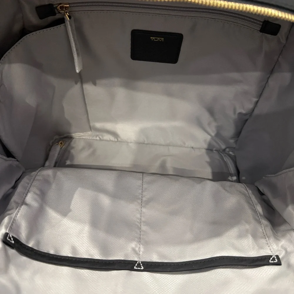 Tumi Backpack in Black with Gold Details and multiple components